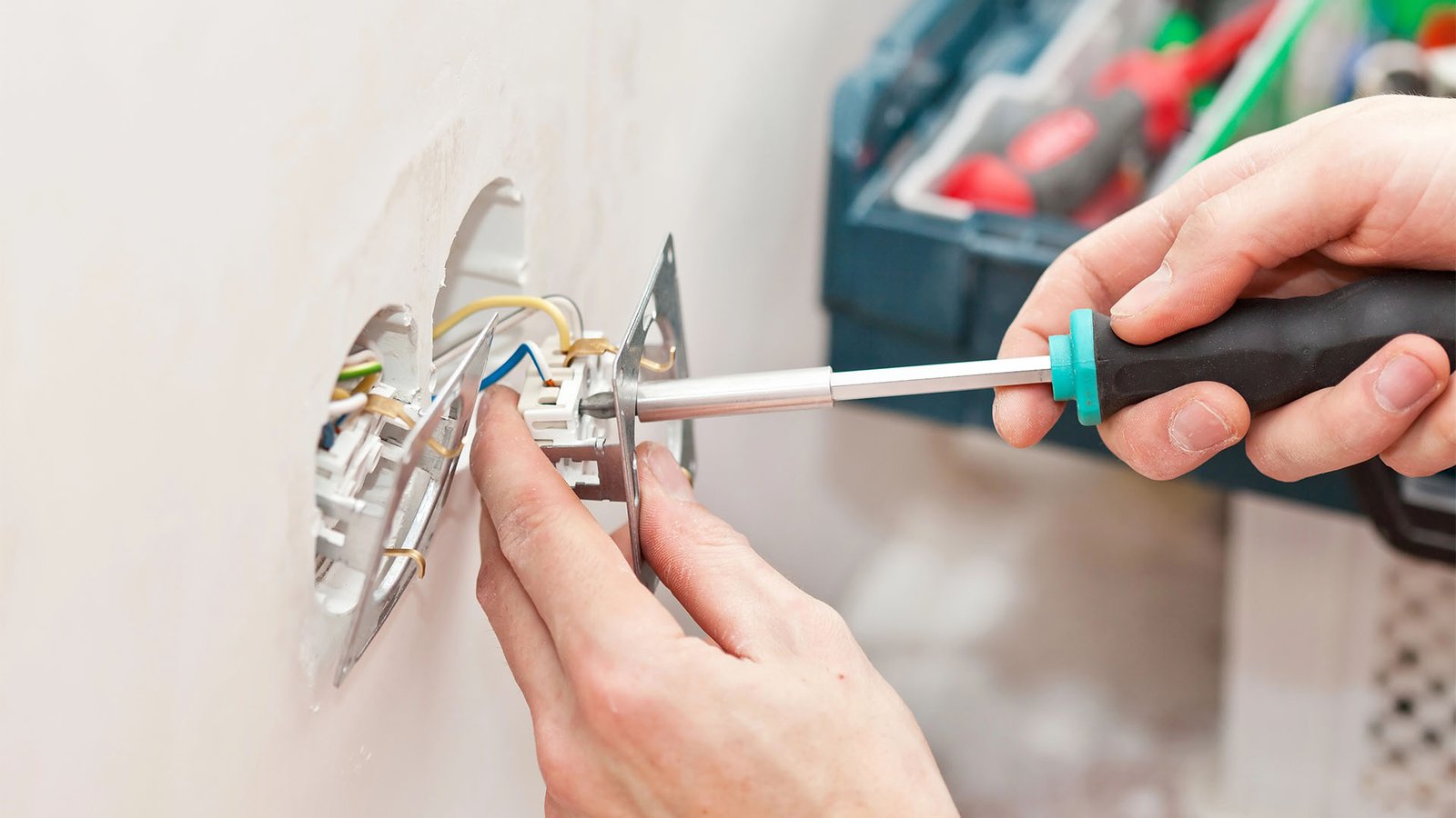 The hands of an electrician